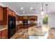 Modern kitchen with granite counters and a breakfast bar at 30773 N 129Th Ave, Peoria, AZ 85383