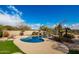 Inviting kidney shaped pool with waterfall feature at 30773 N 129Th Ave, Peoria, AZ 85383