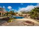 Inviting pool with fire pit and patio seating at 30773 N 129Th Ave, Peoria, AZ 85383