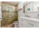 Modern bathroom with a walk-in shower and marble countertops at 3136 W Sunnyside Ave, Phoenix, AZ 85029