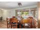 Bright dining room with a round table and pool view at 3136 W Sunnyside Ave, Phoenix, AZ 85029