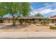 Ranch style home with landscaped yard and two-car garage at 3136 W Sunnyside Ave, Phoenix, AZ 85029