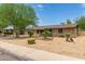 Ranch style home with landscaped yard and two-car garage at 3136 W Sunnyside Ave, Phoenix, AZ 85029