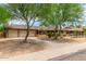 Ranch style home with landscaped yard and two-car garage at 3136 W Sunnyside Ave, Phoenix, AZ 85029