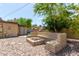 Relaxing fire pit area with built-in seating at 3136 W Sunnyside Ave, Phoenix, AZ 85029