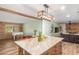 Kitchen island with granite countertop and seating for four at 3136 W Sunnyside Ave, Phoenix, AZ 85029