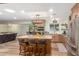 Modern kitchen with granite island, stainless steel appliances, and wooden cabinets at 3136 W Sunnyside Ave, Phoenix, AZ 85029