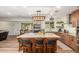 Modern kitchen with granite island, stainless steel appliances, and wooden cabinets at 3136 W Sunnyside Ave, Phoenix, AZ 85029