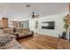 Spacious living room with hardwood floors and a view of the kitchen at 3136 W Sunnyside Ave, Phoenix, AZ 85029