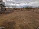 Backyard with playground equipment and sparse landscaping at 33767 W Grande Rd, Stanfield, AZ 85172