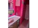 Bathroom with pink walls and tiled floor at 33767 W Grande Rd, Stanfield, AZ 85172