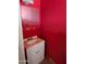 Small bathroom with red walls and a white vanity at 33767 W Grande Rd, Stanfield, AZ 85172