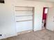 Bedroom with built-in shelving and bathroom access at 33767 W Grande Rd, Stanfield, AZ 85172