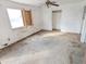 Bedroom with ceiling fan and worn carpet at 33767 W Grande Rd, Stanfield, AZ 85172