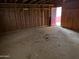 Unfinished garage with dirt floor and pink door at 33767 W Grande Rd, Stanfield, AZ 85172