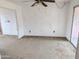 Living room features carpeted floors and ceiling fan at 33767 W Grande Rd, Stanfield, AZ 85172