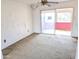 Living room with sliding glass doors and ceiling fan at 33767 W Grande Rd, Stanfield, AZ 85172