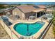 Aerial view showcasing a kidney-shaped pool and expansive backyard at 3818 N Kalispell Ct, Casa Grande, AZ 85122