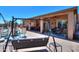 Backyard with patio, seating, and a covered area at 3818 N Kalispell Ct, Casa Grande, AZ 85122