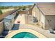 Elevated view of the backyard with pool, patio, and storage shed at 3818 N Kalispell Ct, Casa Grande, AZ 85122