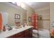 Bathroom features double vanity, tile shower/tub, and southwestern accents at 3818 N Kalispell Ct, Casa Grande, AZ 85122