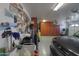 Garage with cabinets, sink, and work area; well-organized at 3818 N Kalispell Ct, Casa Grande, AZ 85122