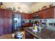 Spacious kitchen with granite countertops and stainless steel appliances at 3818 N Kalispell Ct, Casa Grande, AZ 85122