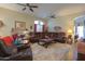 Spacious living room with leather furniture and southwestern decor at 3818 N Kalispell Ct, Casa Grande, AZ 85122