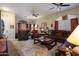 Living room with southwestern decor, leather furniture, and fireplace at 3818 N Kalispell Ct, Casa Grande, AZ 85122