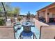 Relaxing patio with fire pit and seating, adjacent to the pool at 3818 N Kalispell Ct, Casa Grande, AZ 85122