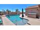 Inviting kidney-shaped pool with spa and ample surrounding patio space at 3818 N Kalispell Ct, Casa Grande, AZ 85122