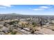 Aerial view of property with distant mountain views and surrounding landscape at 4035 W Country Gables Dr, Phoenix, AZ 85053