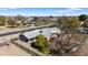 Aerial view of a ranch-style home with a carport and mature trees at 4035 W Country Gables Dr, Phoenix, AZ 85053