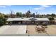 Aerial view of a ranch-style home with large yard and detached garage at 4035 W Country Gables Dr, Phoenix, AZ 85053