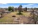 Aerial view of a large lot with a tractor and open space at 4035 W Country Gables Dr, Phoenix, AZ 85053