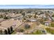 Aerial view showing a single-Gathering home with a large yard and a pool at 4035 W Country Gables Dr, Phoenix, AZ 85053