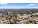 Wide aerial view of property, showcasing surrounding landscape and neighborhood at 4035 W Country Gables Dr, Phoenix, AZ 85053