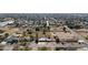 Wide aerial view of a home with surrounding neighborhood and landscape at 4035 W Country Gables Dr, Phoenix, AZ 85053