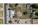 Aerial view of a home with a large lot, featuring a garden and outbuildings at 4035 W Country Gables Dr, Phoenix, AZ 85053