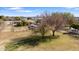 Aerial view showing a large yard with mature trees and a covered area at 4035 W Country Gables Dr, Phoenix, AZ 85053