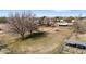 Aerial view of property showcasing expansive land, mature trees, and farm equipment at 4035 W Country Gables Dr, Phoenix, AZ 85053