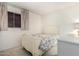 Charming bedroom with floral bedding and a white dresser at 4035 W Country Gables Dr, Phoenix, AZ 85053