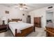 Bright bedroom with double bed and wood dresser at 4035 W Country Gables Dr, Phoenix, AZ 85053