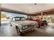 Garage with classic car and tractor at 4035 W Country Gables Dr, Phoenix, AZ 85053