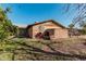 Rear view of house, showing exterior and yard at 4035 W Country Gables Dr, Phoenix, AZ 85053