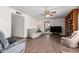 Living room with wood floors and built-in shelving at 4035 W Country Gables Dr, Phoenix, AZ 85053