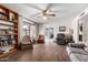 Bright living room with hardwood floors and comfy seating at 4035 W Country Gables Dr, Phoenix, AZ 85053