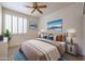 Guest bedroom with double bed, neutral decor, and plenty of natural light at 4116 E Sunnyside Dr, Phoenix, AZ 85028