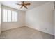 Bright bedroom with ceiling fan and carpet at 4116 E Sunnyside Dr, Phoenix, AZ 85028