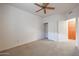 Bedroom with double door closet and ceiling fan at 4116 E Sunnyside Dr, Phoenix, AZ 85028